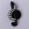 Treble clef brooch (pin)