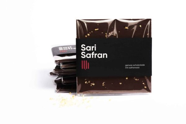 Handmade chocolate bar with saffron salt flakes