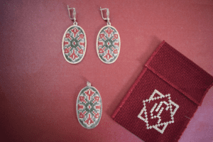 Pendant and earrings with an Armenian ornament framed by silver