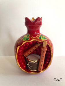 Pomegranate with musical instruments