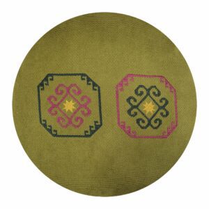 An embroidered round pillow with an old Armenian rug ornament