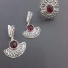 silver jewelry with red stone
