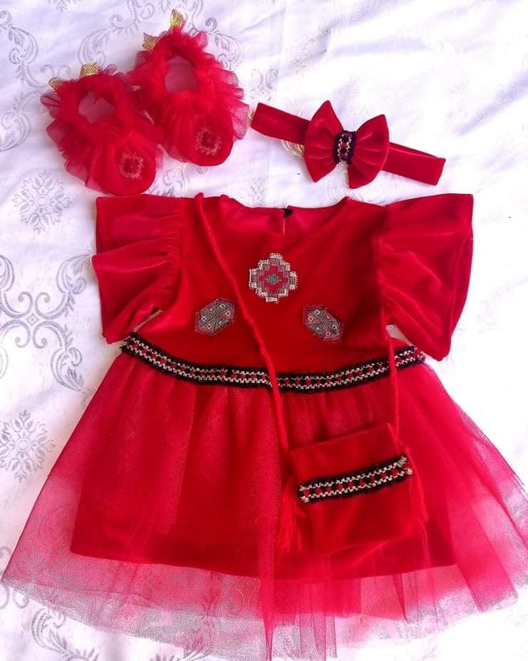 a girl's red dress with shoes and headband