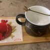 Decorative coffee mug with saucer and spoon