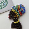 African woman beded brooch