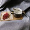 Decorative coffee mug with saucer and spoon