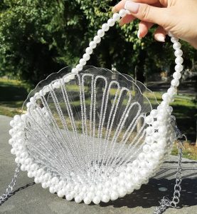 Shell bag with shiny stones and white pearls