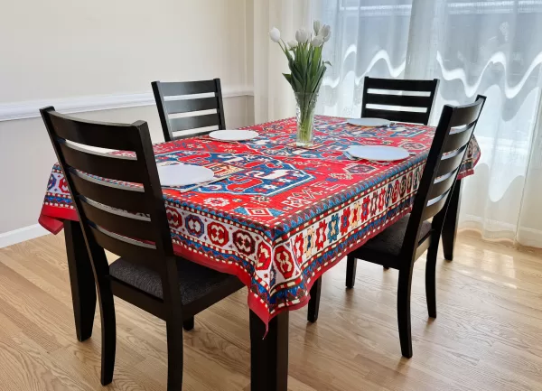 table cloth indoors with vase and plates