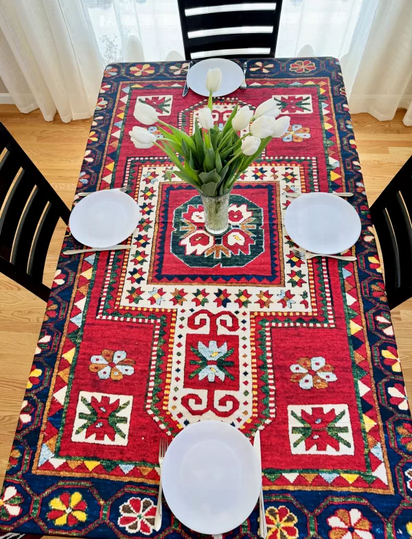 table cloth indoors with plates and a vase